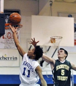 Southampton Academy junior Tonee Hill goes in for a lay-up against Kenston Forest on Tuesday. Hill scored 27 points to help lead the Raiders to tonight’s semifinals in the Virginia Commonwealth Conference tournament. -- Jim Hart |Tidewater News