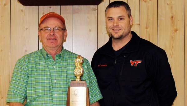 Chris Drake, agriculture extension agent for Southampton County, right, stands with Walter Drake, who received the 2012 Southampton County Peanut Production Trophy during The Virginia Peanut Growers Association meeting at the Southampton County Fairgrounds. -- SUBMITTED