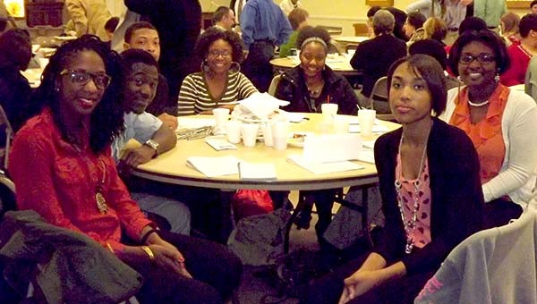 Local students, including a group from Franklin High School, attended the Franklin-Southampton Area Chamber’s Post Legislative Eggs & Issues event Friday morning at the Franklin Baptist Church fellowship hall. Pictured are Dikeya Cox, from left, Travis Brown, JaVonte’ Blacknall, Elizabeth Whitehead, Wawijah Jones, William Jackson, Summer Dorsey and Kelly Felton. -- Lucy Wallace/Tidewater News