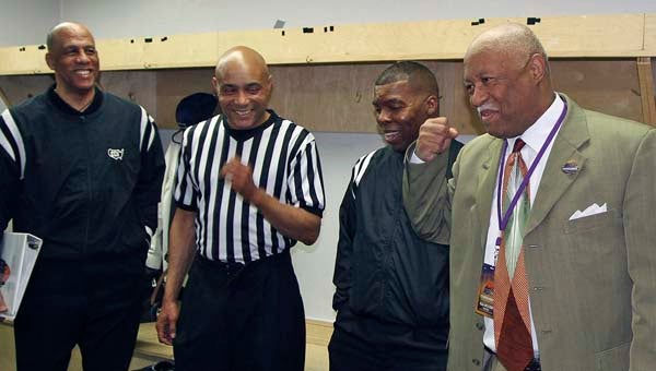 Courtland man Larry Rose, the coordinator for men’s basketball officials for the MEAC basketball tournament, discusses calls with some of those officials in the locker room, prior to one of the games. Here are, from left, Quez Crawford, Bill Covington Jr., Winston Stith and Rose. -- Frank A. Davis | Tidewater News