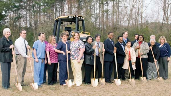 A ground-breaking ceremony for a new orthopedic and physical therapy facility took place Monday at the future location on Fairview Drive. From left, Franklin-Southampton Chamber of Commerce Executive Director Teresa Beale, Southampton Memorial Hospital Director of Rehabilitation Dan Hoctor, Sean Hindman, Sheila Gay, Kristen Myers, Janet Bulls, Julie Holland, Spring Byrum, State Delegate Roslyn Tyler, (D-Jarratt), project architect Armond Reich, SMH Chief Executive Officer Phil Wright, Dr. Manish Patel and wife Vaishali, project engineer Steve Gottlieb, Towne Bank representative Phil Smith, Franklin Mayor Raystine Johnson-Ashburn, Councilwoman Mary Hilliard, City Manager Randy Martin and SMH Assistant CEO Kim Marks. -- ANDREW FAISON/TIDEWATER NEWS