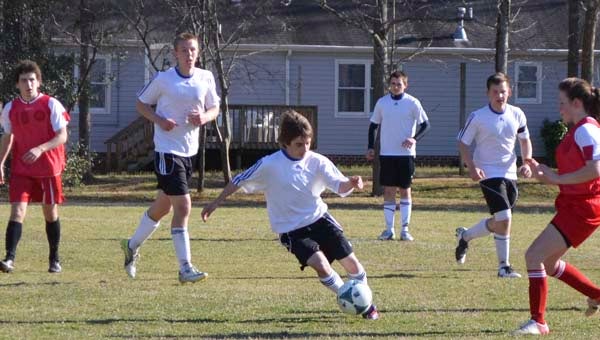 SA eighth grader Emery Weist breaks away from a Fuqua defender as he dribbles the ball up field. -- SUBMITTED
