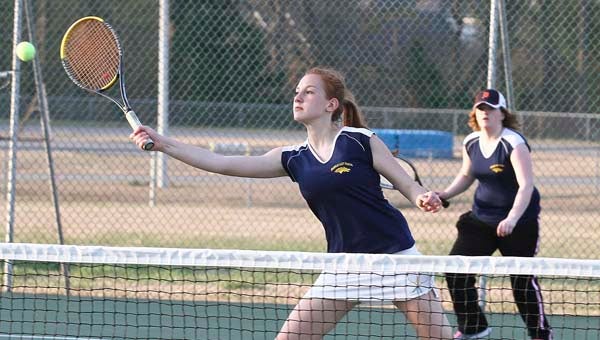 Attacking the net during the #1 doubles match is FHS Kte Vogel, as partner Kaitlyn Trotter watches. The FHS team went on to defeat the Eagles team of Kiana Hancock and Sierra Mitchell 8-4 in an eight game pro set. -- FRANK A. DAVIS/TIDEWATER NEWS