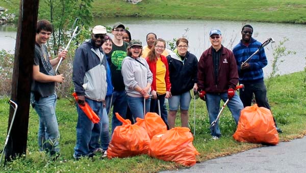 PDCCC Science Team did a fantastic job cleaning up around the retention pond behind the old Methodist Church and the pond behind old Lion State Theatre. Pictured are, from left, Roman Shields, Dr. Safianu Rabiu, Erika Albert, Jordan Hewett, Olivia Walker, Wendy Harrison, Sandra Walker, Carlie Clark, Ellen Hibbs, PDCCC President Dr. Paul W. Conco, and Anthony Holloway. -- Submitted