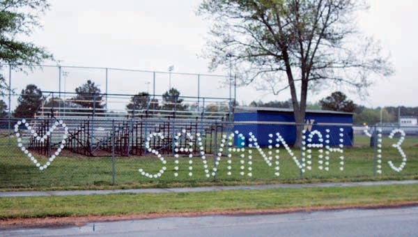 After she died in a Suffolk car wreck on Sunday, Savannah Scheil’s first name was spelled out with Styrofoam cups on the chain-link fence of Windsor High School, where she attended. -- MATTHEW A. WARD/SUFFOLK NEWS-HERALD