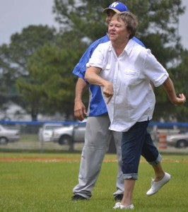 Frances Murray, widow of the late Edward “Tex” Murray, throws the first pitch for the Windsor High Boys Baseball team on Tuesday at the Tex Murray Memorial Field. Behind her is assistant coach Tim Paschal. The Dukes went on to win 27-0 against Sussex Central Tigers. On Wednesday, the boys won 10-5 against Surry High Cougars. The Dukes play in regionals at 5 p.m. Tuesday, May 28, at home. -- Submitted