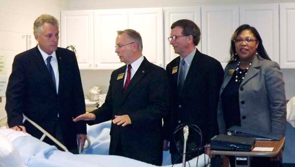 Democratic gubernatorial candidate Terry McAuliffe, left, toured PDCCC’s nursing and Allied Health Simulation Lab with PDCCC President Dr. Paul Conco, Workforce Development Vice President Randy Betz and PDCCC Vice President for Institutional Advancement Felicia Blow. -- LUCY WALLACE/TIDEWATER NEWS
