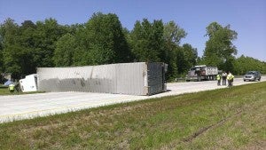 A tractor-trailer overturned westbound on Highway 58 Tuesday, blocking traffic for two and one-half hours. The driver, Rocky Baker of Ruther’s Glenn, Va., was charged with driving under the influence. -- SUBMITTED