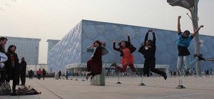Visiting the Olympic Park swimming venue in Beijing, Lawrence and some of her friends jump for joy. -- SUBMITTED/DELYDIA LAWRENCE