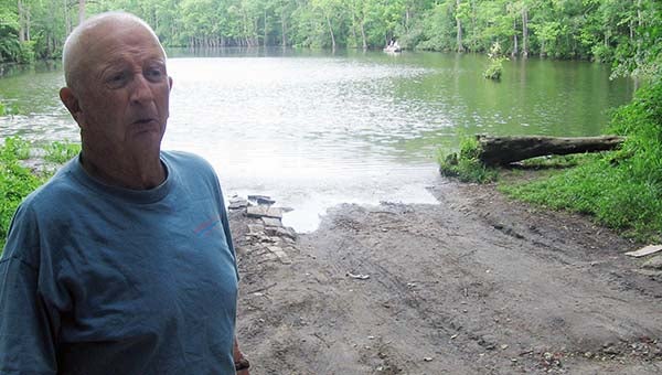 Jesse Drewery of Franklin wants to restore a landing site to Round Gut Creek, which is behind him. The place is a popular one with many fishermen. -- STEPHEN H. COWLES/TIDEWATER NEWS
