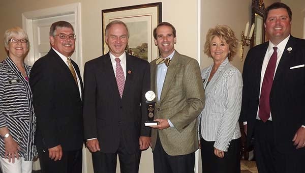 Congressman Randy Forbes, third from left, receives a Spirit of Enterprise Award from Moore Hallmark, executive director of the U.S. Chamber of Commerce, southeast region. With them, from left, are Teresa Beale, executive director of the Franklin-Southampton Area Chamber of Commerce; Bobby Cutchins, chamber president; Melissa Rose, office manager; and Tony Clark, president-elect. The honor was given Friday at the Cypress Cove Country Club, and cosponsored by the local chamber and Franklin Rotary Club. -- STEPHEN H. COWLES | TIDEWATER NEWS