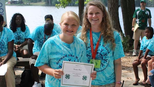 Kristin Holt of Franklin, left, with Celia Brockway, the new 4-H agent for Southampton and Isle of Wight counties. They're shown here at 4-H youth camp in Wakefield this past June. Holt is showing her award in health, one of the four H's of the national organization. Submitted / Neil Clark