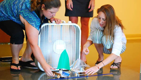Emma Ingram, left, and Robin Gafa, of Carrsville Elementary School, try out wind-powered vehicles they made. This was part of the Virginia Initiative for Science Teaching and Achievement, which was a two-week course at The College of William and Mary. SUBMITTED PHOTO