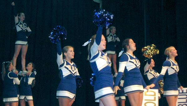 Windsor High School cheerleaders shout out about the blue and gold of their school. They were part of the energetic convocation that took place Monday in the Smithfield High School auditorium. -- STEPHEN H. COWLES | TIDEWATER NEWS