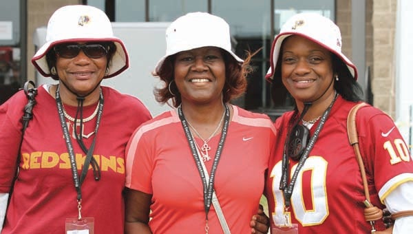 Almeta Davis, center, poses with grandmother Juley Allen, left, and RG3’s mother, Jacqueline “Jackie” Marie Griffin during Redskins Fan Appreciation Day at the Bon Secours Training Center in Richmond. -- FRANK DAVIS | TIDEWATER NEWS