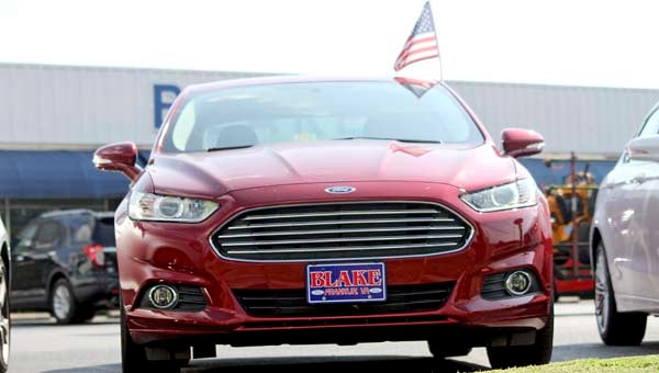 A Ford Fusion on the Blake Ford lot. Small car sales have picked up over the summer, and Travis Futrell, sales manager, said the Ford Fusion Hybrid has been a top seller. -- STEPHEN COWLES | TIDEWATER NEWS