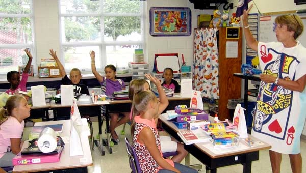 Carrsville Elementary's Debbie Story as the Queen of Hearts calls on her third-grade students to answer a question on the first day of classes. -- Stephen Cowles | Tidewater News