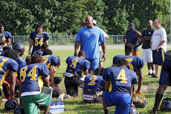 Franklin High coach Darren Parker, and the rest of the coaching staff, take turns motivating the players. The Broncos begin the season today with a road game against Nandua. -- CAIN MADDEN | TIDEWATER NEWS