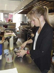 At The Hungry Rooster, co-owner Denise Byrum starts work on a dessert to be served later in the day. "We don't do instant anything," she said about  all the meals prepared at the Boykins establishment. -- STEPHEN H. COWLES | TIDEWATER NEWS