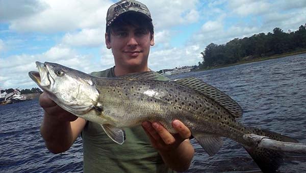 Jake Lusk and his 22-inch Speckled Trout, which won him first place in the Speckled Trout division. -- SUBMITTED