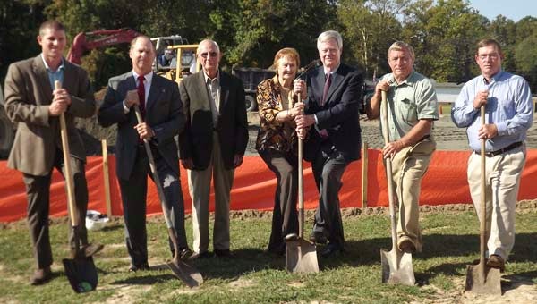Breaking ground for the Early Learning Center at Isle of Wight Academy are Robert Hudson, left, project manager for C.W. Brinkley Construction Co.; Michael King, IWA board president; W.B. Owen, original board director; Nell Owen, a former teacher; Benjamin Vaughan, headmaster; Dwight Doggett Jr. and Mike Doggett, sons of co-founder A. Dwight Doggett Sr. Completion is expected for next August. -- STEPHEN H. COWLES | TIDEWATER NEWS