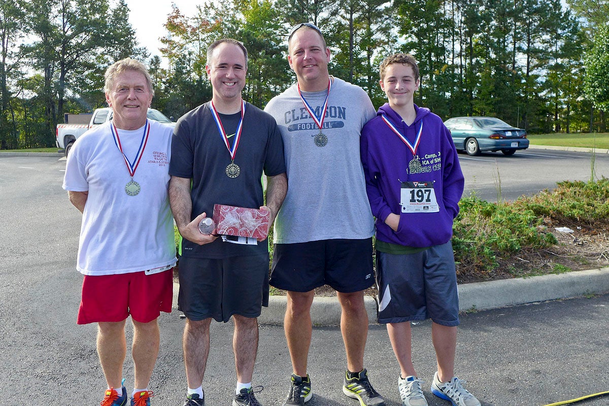SUBMITTED | ANNE BRYANT Top male winners for each age group, from left: Ted Fries, Brent Kimlick, Bryan Fenters, Brandon Fenters. Not pictured: Nickelous Burgess, Jim Jervey.