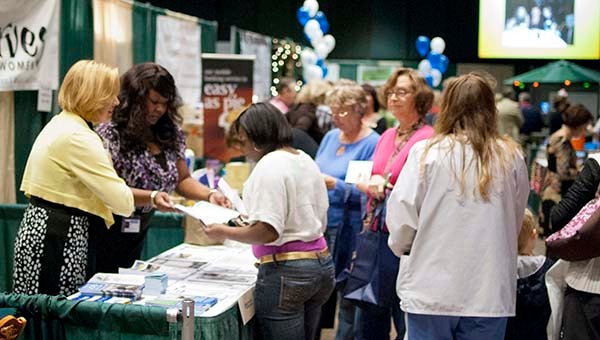 Crowds fill the aisles at the 2012 Chamber Business Expo at the Regional Development Workforce Center at Paul D. Camp Community College. More than 600 people are estimated to have attended. -- FILE PHOTO