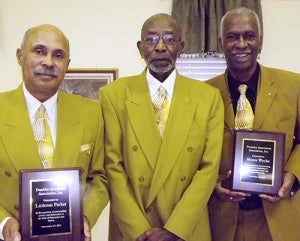 Littleton Parker III, left, and Moses Wyche, right, with John Hollaway, president of the Franklin Sportsman’s Association. For their contributions to community, education and students, the organization recognized Parker and Wyche on Friday morning during the annual Hayden Reunion Breakfast. -- STEPHEN H. COWLES | TIDEWATER NEWS