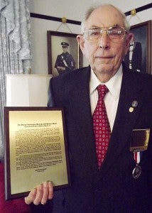 In addition to being presented the George Washington Distinguished Service Award, Hoen M. Edwards Jr. holds up a plaque describing his service to Masonry. -- STEPHEN H. COWLES | TIDEWATER NEWS