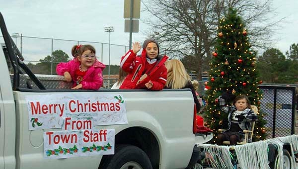 Town Manager, Mike Stallings, drives truck with staff members and their children on float -- Merle Monahan | Tidewater News