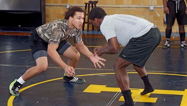 Jack Sykes, left, faces off against Nathan Jones, a helper. -- Cain Madden | Tidewater News