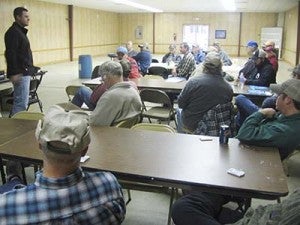 Southampton County extension agent Chris Drake, left, speaks to farmers needing to be recertified in pesticide application. Drake figures to recertify about 50 license holders from Tuesday and Thursday’s sessions. STEPHEN H. COWLES | TIDEWATER NEWS