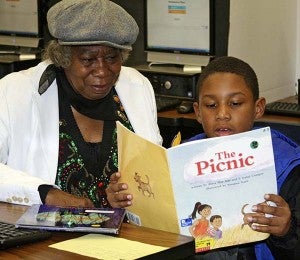 Raigyn Ruffin is a second-grade student in Ms. Amos’ homeroom, and he was reading with his great-grandmother, Evelyn Goodman. -- FRANK DAVIS | TIDEWATER NEWS