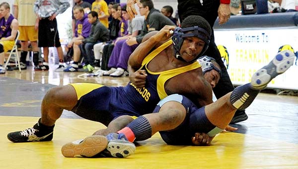 Franklin’s Bennie Jones holds down another wrestler. -- Frank Davis | Tidewater News
