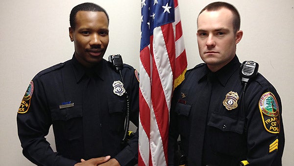 Officer Quentin Livingston, left, and Sgt. Todd Lyons of the Franklin Police Department. The men ran into a burning building when they found out a woman was inside, and they were able to rescue her.