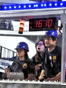 Lizzie Conner, left, Cindy Mitrovic and George Mitrovic drive the robot -- PHOTOS COURTESY MATTHEW GLENNON