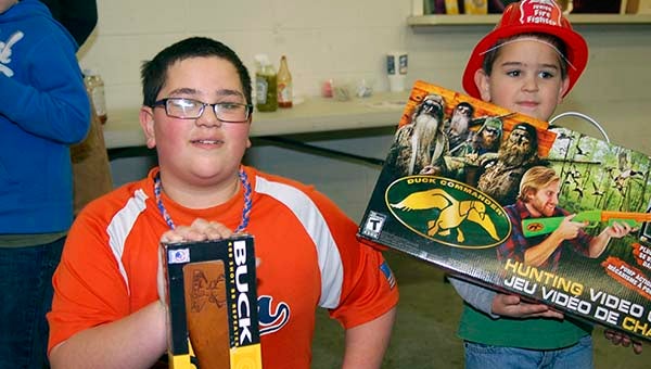Andrew, 12, left, and Landon Power, 4, won prizes at the gun bash. The boys are the sons of David Power of Ivor. Merle Monahan | Tidewater News