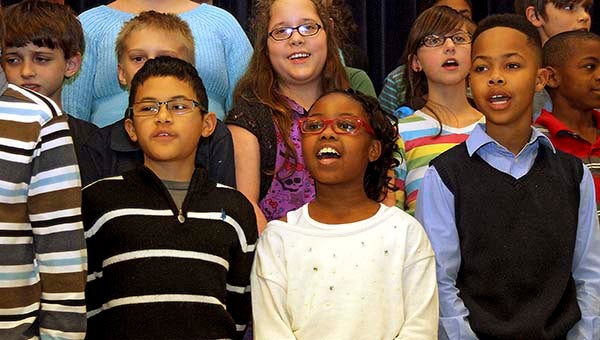 Fourth and fifth graders, including Miles Bland, left, Chloe Pope and Jonah Blythe sing “Free at Last” -- CAIN MADDEN | TIDEWATER NEWS