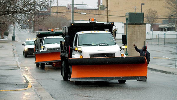 Franklin City Street Crews spread treatment throughout Downtown Franklin to help keep the roads from freezing. -- Cain Madden | Tidewater News