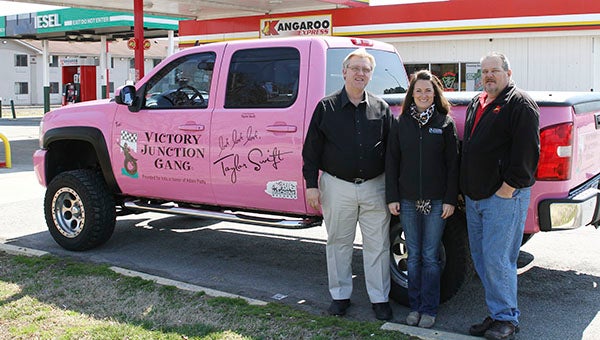 Kangaroo Express District Manager David Stover, left, with Nicole Conner, who is a staff member of Victory Junction and the truck driver, and Randy Bullock, store manager in Franklin. -- FRANK DAVIS | TIDEWATER NEWS