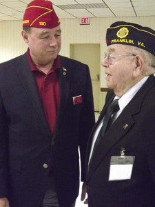 Dan Dellinger, left, national commander of the American Legion, talks with George Burgess of Post 73. The 87-year-old Burgess is an Army veteran of World War II. -- STEPHEN H. COWLES | TIDEWATER NEWS