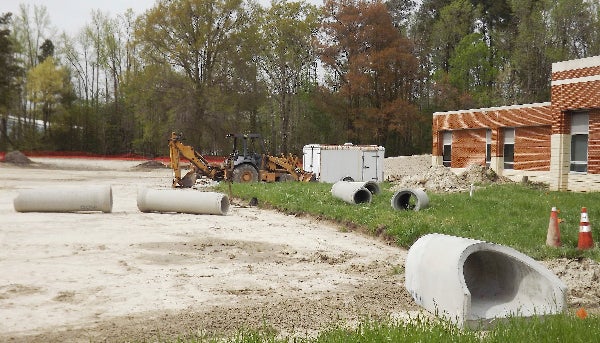 A drainage system is being created to stop flooding in the Regional Workforce Development Center at Paul D. Camp Community College. -- STEPHEN H. COWLES | TIDEWATER NEWS