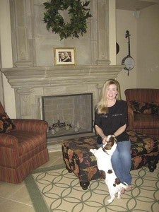 Holly Fowler in the great room of her French country-style home in Courtland. -- SUBMITTED