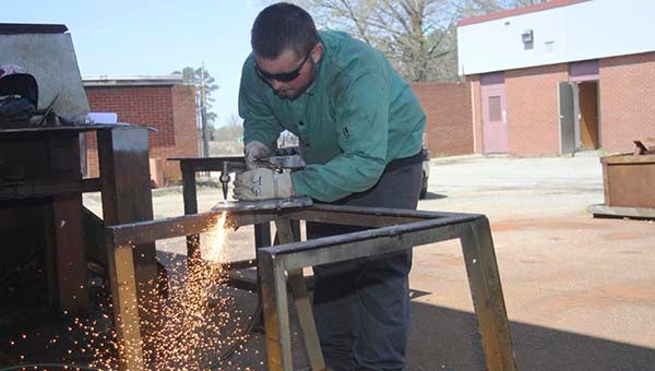 Jacob Gray practices cutting at the Pruden Center in Suiffolk. -- CAIN MADDEN | TIDEWATER NEWS