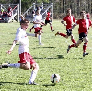Michael Mullen looks to kick a goal against Fuqua. Mullen had a goal on Wednesday in the semi-final match. -- Cain Madden | Tidewater News