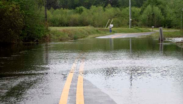 Water floods over Tucker Swamp Road near Ivor. -- CAIN MADDEN | TIDEWATER NEWS