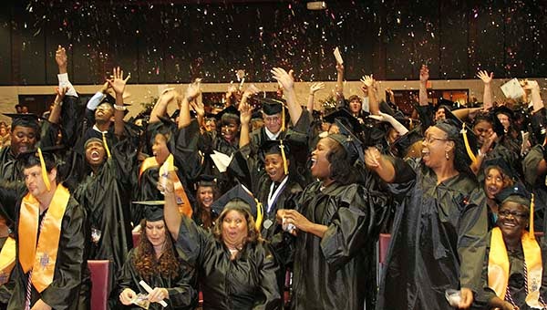Graduates at Paul D. Camp Community College celebrate receiving their diplomas by throwing confetti in the air. The ceremony took place Friday at the Regional Workforce Development Center at the college in Franklin. -- SUBMITTED | DON BRIDGERS
