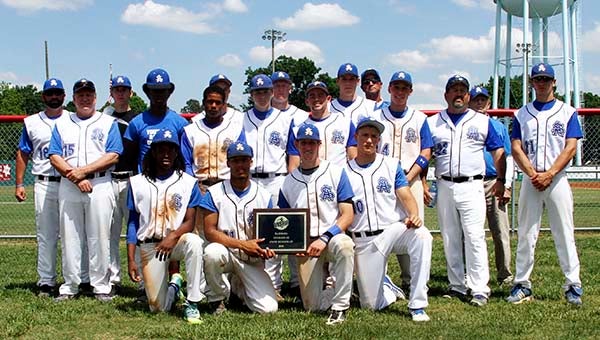 The raiders pose with the runner-up award after the game. -- Frank Davis | Tidewater News