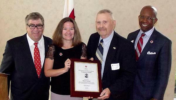 Clyde Parker, second from right, receives the Justine Lowenberg Nusbaum Award for his “exceptional volunteer service” to the American Red Cross of Southeastern Virginia. With him, from left, are Charlie Nusbaum, chairman of the Southeastern Virginia Chapter Board of Directors; Erin Zabel, executive director, Southeastern chapter); and Reggie Gordon, chief executive officer, Southeastern Virginia Region. Parker is chairman of the Franklin-Southampton Advisory Committee and a board member of the Southeastern chapter. -- SUBMITTED