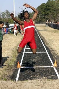Devine Fenner, Southampton High School, jumps at a track meet in Franklin. He finished first in the long jump at the East regional with a jump of 22 feet and 8.25 inches. Fenner will compete in the state track and field tournament for the 100-meter, 200-meter and 400-meter dashes, as well as the long jump. -- Cain Madden | Tidewater News